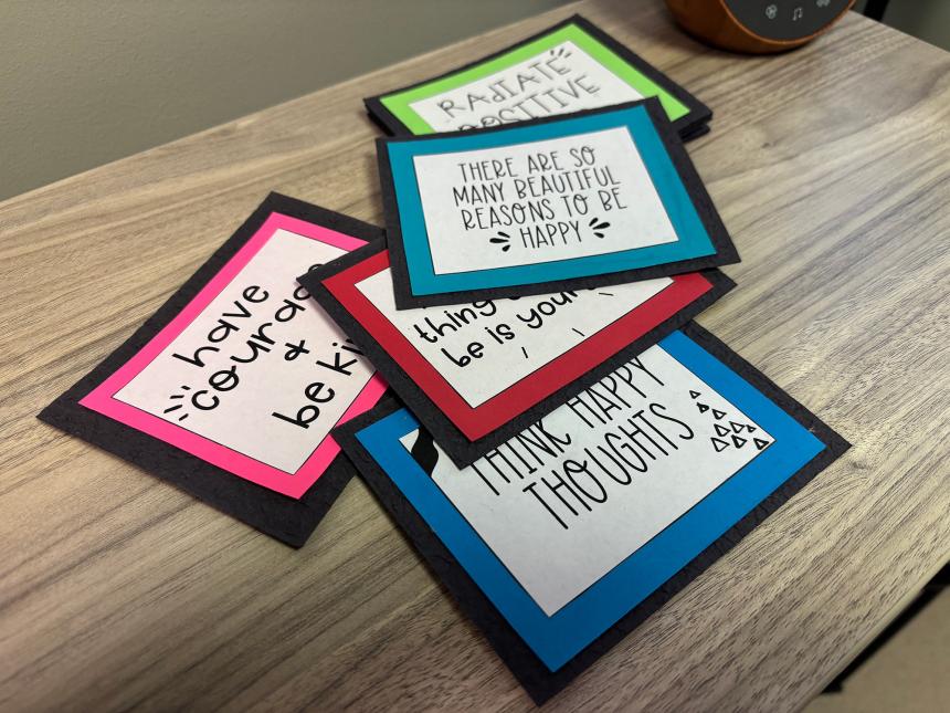 picture of a stack of paper cards with positive messages written on them