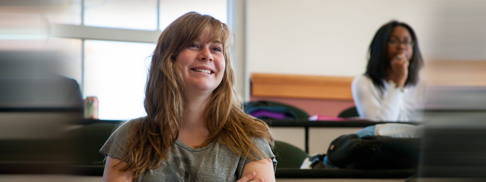 A female student smiles in Daleah Goodwin's class at UGA